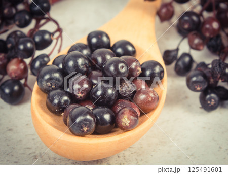 Fresh elderberry containing vitamins and minerals. Healthy nutrition, natural methods of treatment Fresh elderberry containing vitamins and minerals. Healthy nutrition, natural methods of treatment 125491601