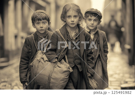 Group of children walking through a historical street in a vintage setting while carrying bags during the late 19th century 125491982