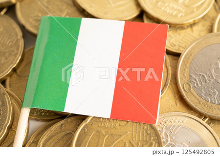 Italy flag on coin and banknote money, finance trading investment business currency concept. Italy flag on coin and banknote money, finance trading investment business currency concept. 125492805