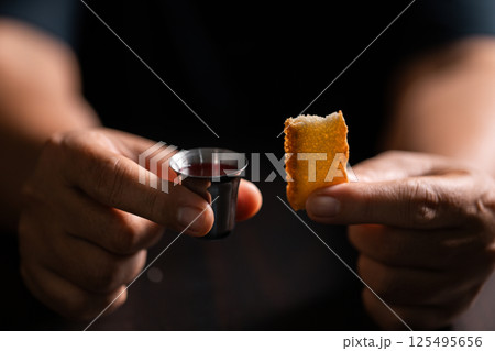 Sacred ceremony of Communion, Christians express their faith by partaking in holy bread, deepening their spiritual connection with God within the church. communion, religion, christian, faith, holy. 125495656