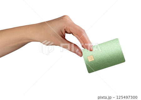 Card in female hand. Green plastic bankcard held front side, used for payment, shopping, finance, 125497300