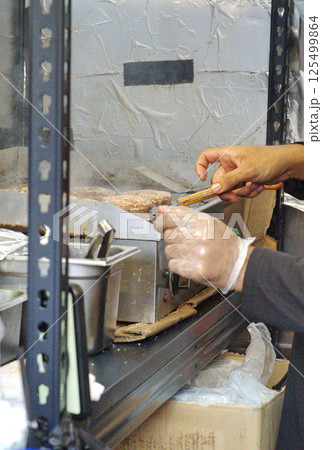 Night bazaar stall selling burgers 125499864