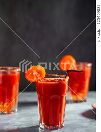 Three refreshing vegetable cocktail. Tomato juice served in glass with tomato slice. Image for menu, bars, restaurants Three refreshing vegetable cocktail. Tomato juice served in glass with tomato slice. Image for menu, bars, restaurants 125499883