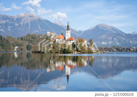 Church in the middle of lake with castle in backdrop, Bled, Slovenia, Europe Church in the middle of lake with castle in backdrop, Bled, Slovenia, Europe 125500020