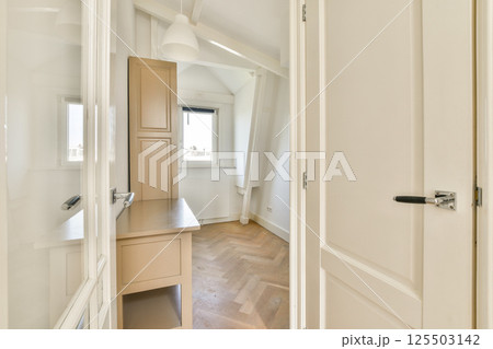 A well-lit, modern interior showcasing elegant design elements with wooden flooring and minimalist decor that creates a serene environment. A well-lit, modern interior showcasing elegant design elements with wooden flooring and minimalist decor that creates a serene environment. 125503142