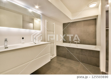 Sleek and stylish bathroom featuring contemporary fixtures, clean lines, and elegant decor. A perfect blend of functionality and aesthetics. Sleek and stylish bathroom featuring contemporary fixtures, clean lines, and elegant decor. A perfect blend of functionality and aesthetics. 125503690
