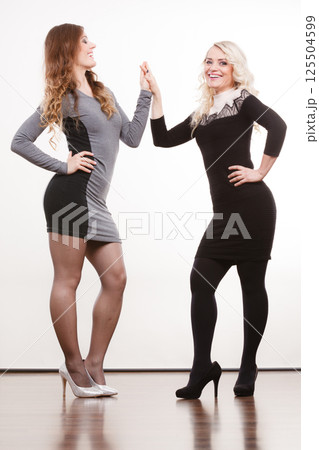 Elegant mother and daughter posing 125504599