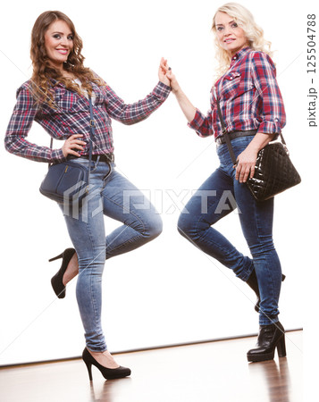 adult daughter and mother with handbags adult daughter and mother with handbags 125504788