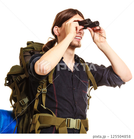 Man tourist backpacker looking through binoculars. 125504858