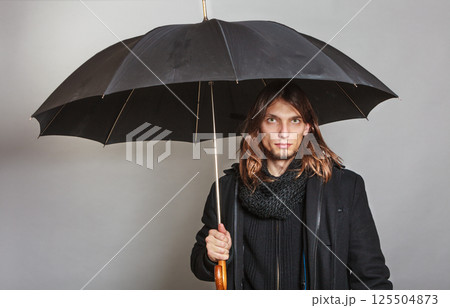 Handsome fashion man portrait wearing black coat. Handsome fashion man portrait wearing black coat. 125504873