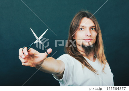 Hairstylist with scissors in hand Hairstylist with scissors in hand 125504877
