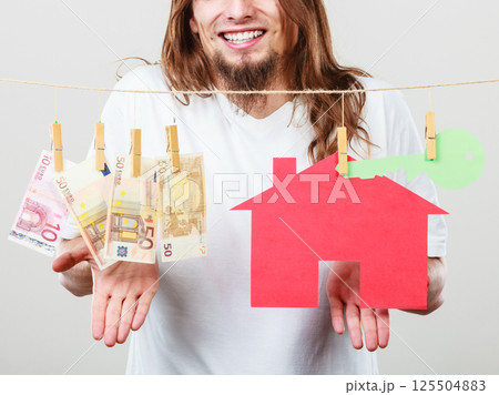 Man seller with money and house Man seller with money and house 125504883