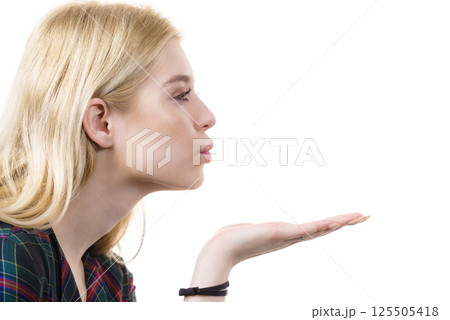 Woman sending air kiss 125505418