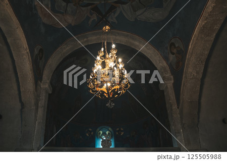 Interior of an Orthodox Georgian church with icons and an altar 125505988