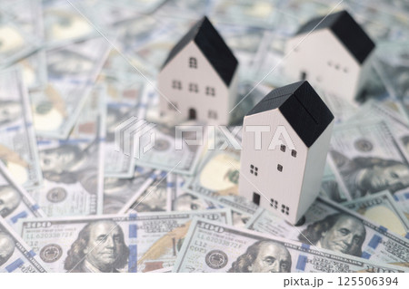 Finance home investments concept. Mortgage from the bank is essential for financing home investments, while insurance safeguards real estate property in volatile business of finance. house investment 125506394