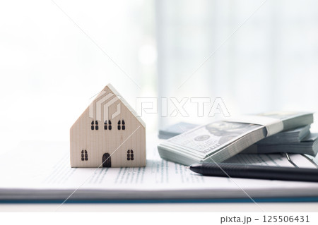 Finance home investments concept. Mortgage from the bank is essential for financing home investments, while insurance safeguards real estate property in volatile business of finance. house investment Finance home investments concept. Mortgage from the bank is essential for financing home investments, while insurance safeguards real estate property in volatile business of finance. house investment 125506431
