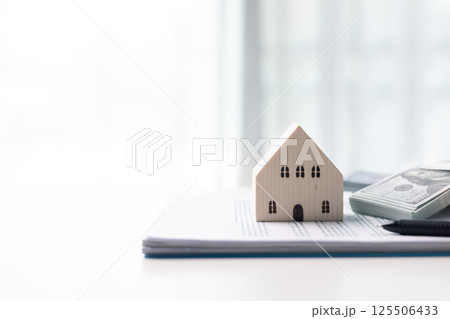 Finance home investments concept. Mortgage from the bank is essential for financing home investments, while insurance safeguards real estate property in volatile business of finance. house investment Finance home investments concept. Mortgage from the bank is essential for financing home investments, while insurance safeguards real estate property in volatile business of finance. house investment 125506433