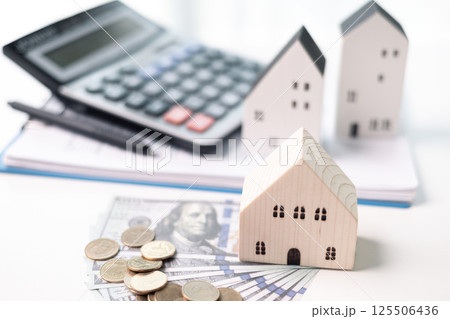 Finance home investments concept. Mortgage from the bank is essential for financing home investments, while insurance safeguards real estate property in volatile business of finance. house investment Finance home investments concept. Mortgage from the bank is essential for financing home investments, while insurance safeguards real estate property in volatile business of finance. house investment 125506436