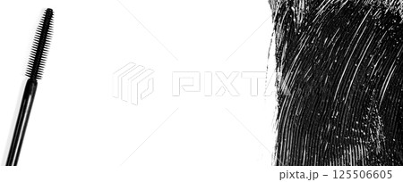 The texture of black mascara and an eyelash brush. Copy space 125506605