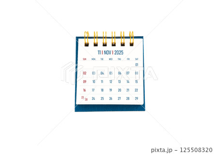 November 2025 blank desk calendar stand on white background. November 2025 blank desk calendar stand on white background. 125508320