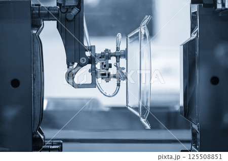 The plastic kitchen wear parts production process by injection machine in the light blue scene. 125508851