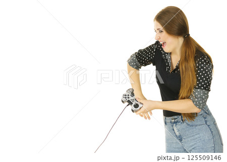 Gamer woman holding gaming pad 125509146