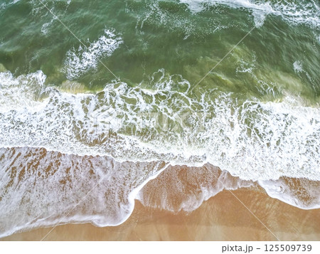 Breathtaking Tropical Beach Scene with Soft White Sand, Crystal Clear Water, and Gentle Ocean Waves Breathtaking Tropical Beach Scene with Soft White Sand, Crystal Clear Water, and Gentle Ocean Waves 125509739