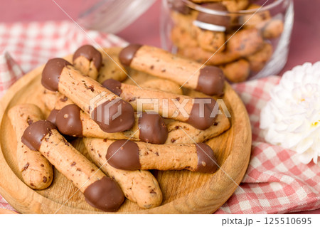 Sticks shortbread dipped in chocolate. Home made cookies 125510695