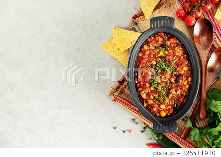 Mexican Chili Con Carne with Corn Chips, Peppers, and Tomatoes 125511910