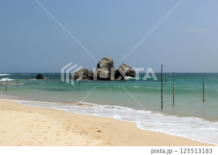 Coastal Rocks and Waves on a Clear Day 125513183