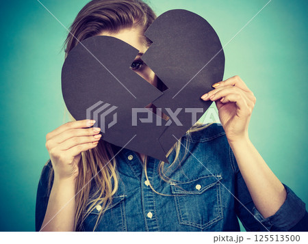 Young woman with broken heart 125513500