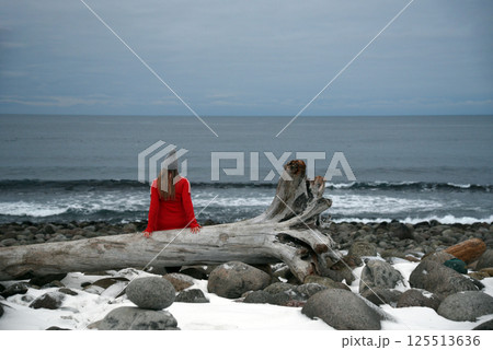 Individual Relaxing in Snowy Landscape Individual Relaxing in Snowy Landscape 125513636