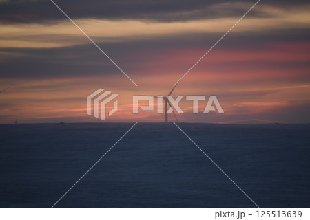 Wind Turbine at Sunset in a Winter Landscape Wind Turbine at Sunset in a Winter Landscape 125513639