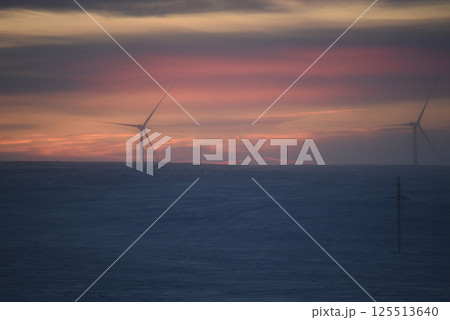 Wind Turbine at Sunset in a Winter Landscape Wind Turbine at Sunset in a Winter Landscape 125513640