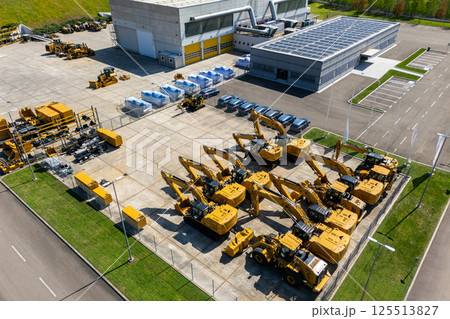 Solar powered construction machinery distribution and service center. Aerial view 125513827
