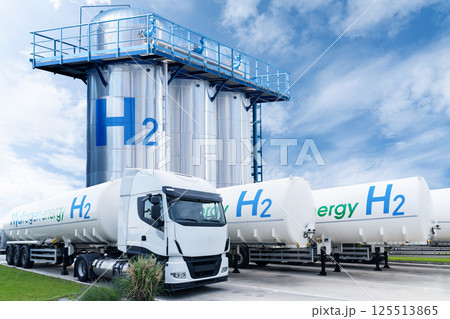 Hydrogen tank trailers with hydrogen storage in the background Hydrogen tank trailers with hydrogen storage in the background 125513865