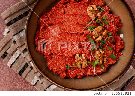 Mahammara red pepper sauce, with walnuts, and sprigs of fresh microgreens, homemade, no people, 125513921