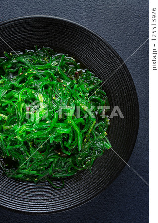 Chuka salad, made from fresh seaweed, with sesame dressing, served in a black bowl, Chuka salad, made from fresh seaweed, with sesame dressing, served in a black bowl, 125513926