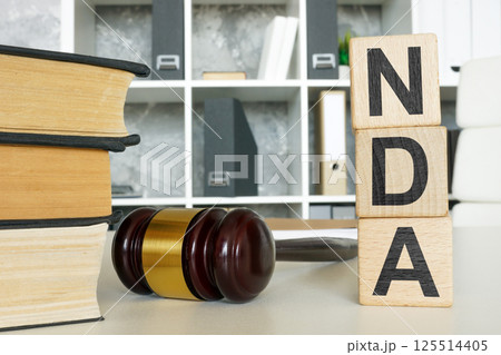 Non-disclosure agreement NDA and gavel. Confidentiality protection. 125514405