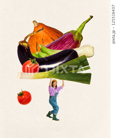 Happy, young farmer woman lifting giant vegetable mix including eggplant, tomato, pumpkin against light background. 125516437