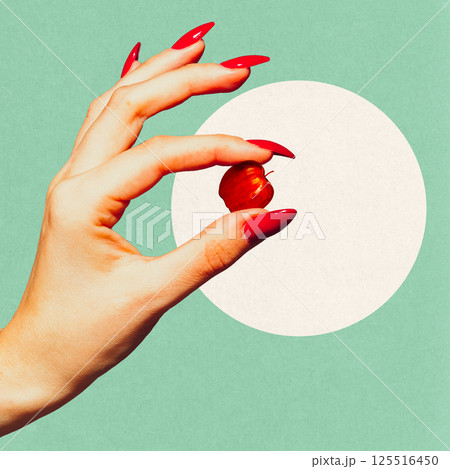 Female giant hand with red nails holding tiny red apple against minimal background. Contemporary art collage. Female giant hand with red nails holding tiny red apple against minimal background. Contemporary art collage. 125516450