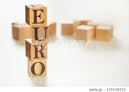 Four wooden cubes arranged in stack with word EURO on them, space for text / image at down right corner Four wooden cubes arranged in stack with word EURO on them, space for text / image at down right corner 125516552