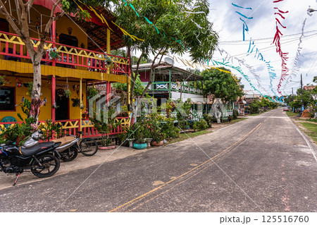 Colorful natural-framed houses with balconies at Pesqueiro, Soure in Marajo Island, Brazil. Colorful natural-framed houses with balconies at Pesqueiro, Soure in Marajo Island, Brazil. 125516760