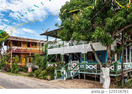 Colorful natural-framed houses with balconies at Pesqueiro, Soure in Marajo Island, Brazil. Colorful natural-framed houses with balconies at Pesqueiro, Soure in Marajo Island, Brazil. 125516761