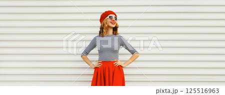 Beautiful happy smiling young woman, pretty girl in red skirt, french beret, heart shaped glasses Beautiful happy smiling young woman, pretty girl in red skirt, french beret, heart shaped glasses 125516963