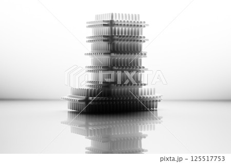 The black and white children's construction set emphasizes the geometry of shapes and textures. The play blocks are laid out on a light background, creating a calm visual effect. 125517753