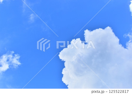 big cloud in clear blue sky background big cloud in clear blue sky background 125522817