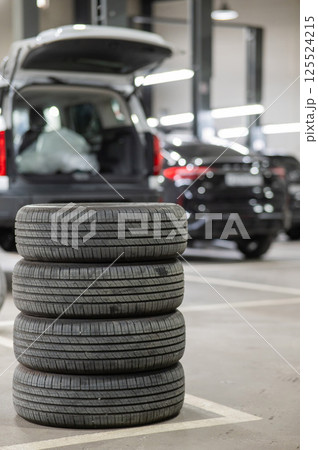 Changing tires for a car according to the season. Changing tires for a car according to the season. 125524215