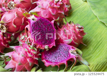 closeup dragon fruit on banana leaf. closeup dragon fruit on banana leaf. 125524475