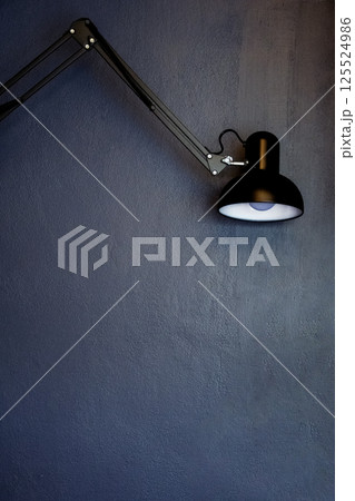 lamp on on dark blue wall background 125524986